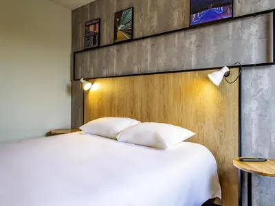 Un ou plusieurs lits dans un hébergement de l'établissement ibis Tours Sud