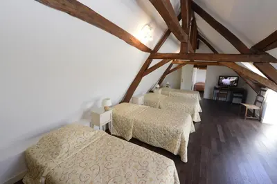 Un ou plusieurs lits dans un hébergement de l'établissement The Originals City, Hôtel Le Cheval Rouge, Tours Ouest