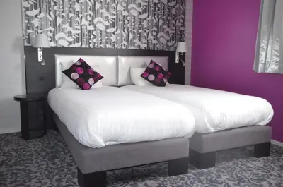 Un ou plusieurs lits dans un hébergement de l'établissement Au Relais Saint-Éloi, Tours