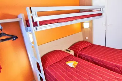 Un ou plusieurs lits dans un hébergement de l'établissement Premiere Classe Tours Sud - Joue Les Tours