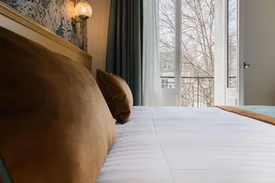 Un ou plusieurs lits dans un hébergement de l'établissement Best Western Hôtel De France