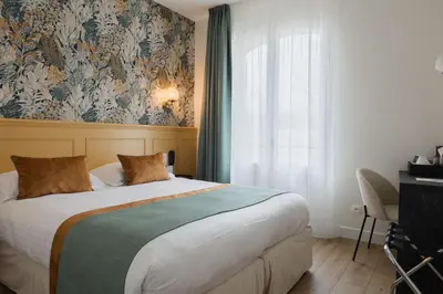 Un ou plusieurs lits dans un hébergement de l'établissement Best Western Hôtel De France