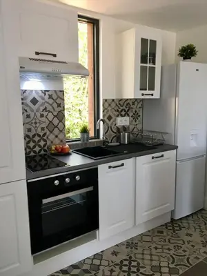 Cuisine ou kitchenette dans l'établissement COTTAGE A LA FONTAINE DU CHENE