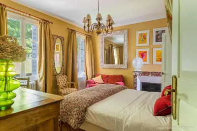 Un ou plusieurs lits dans un hébergement de l'établissement Les Jardins Haute Couture