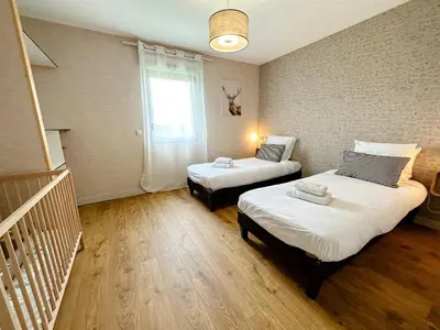 Un ou plusieurs lits dans un hébergement de l'établissement Gites-domainedupin, cottage 