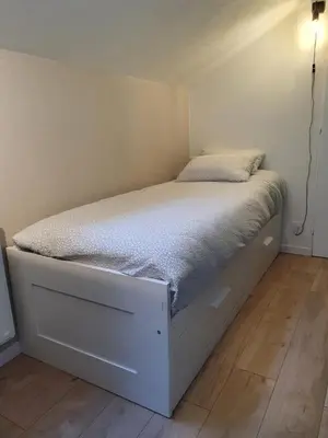 Un ou plusieurs lits dans un hébergement de l'établissement Appartement Pierres de Loire- Linge inclus -1er étage