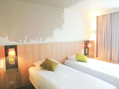 Un ou plusieurs lits dans un hébergement de l'établissement ibis Styles Tours Sud