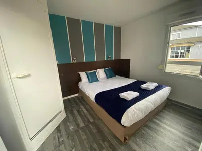 Un ou plusieurs lits dans un hébergement de l'établissement Fasthotel Tours Nord