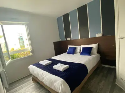 Un ou plusieurs lits dans un hébergement de l'établissement Fasthotel Tours Nord