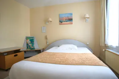 Un ou plusieurs lits dans un hébergement de l'établissement Hotel De Rosny