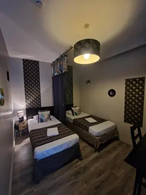 Un ou plusieurs lits dans un hébergement de l'établissement Hotel Saint François Précigné Soirée étape sur demande Proche Sablé-sur-Sarthe