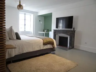 Un ou plusieurs lits dans un hébergement de l'établissement L'HOTEL PARTICULIER - LE MANS