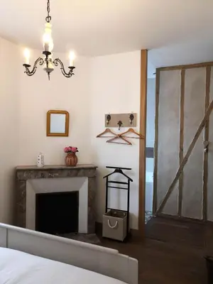 Un ou plusieurs lits dans un hébergement de l'établissement Le Manoir du Gouverneur