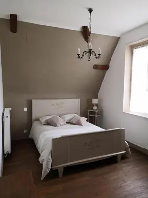 Un ou plusieurs lits dans un hébergement de l'établissement Le Manoir du Gouverneur