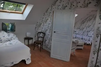 Un ou plusieurs lits dans un hébergement de l'établissement L'Orangerie du Château - LE NID - GITE 2 Personnes