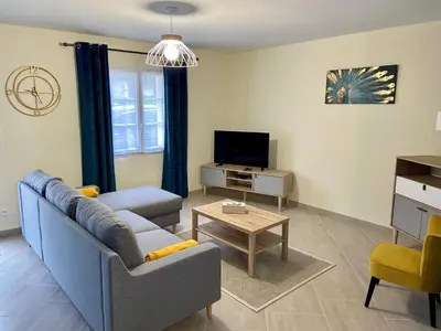 Télévision ou salle de divertissement dans l'établissement Gîte Hibiscus