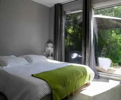 Un ou plusieurs lits dans un hébergement de l'établissement Les Cabanes de Do