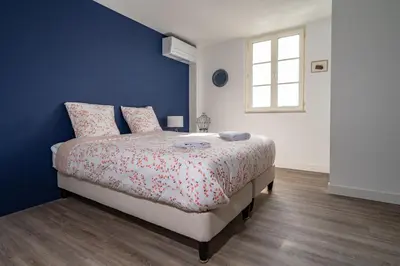 Un ou plusieurs lits dans un hébergement de l'établissement L'Auberge du Croissant