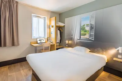 Un ou plusieurs lits dans un hébergement de l'établissement B&B HOTEL Tours Nord 2 La petite Arche