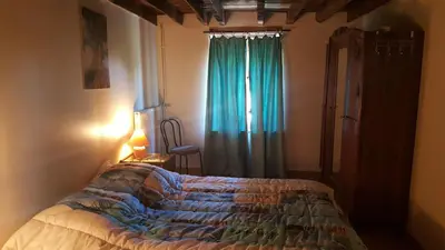 Un ou plusieurs lits dans un hébergement de l'établissement Grand gîte à la campagne