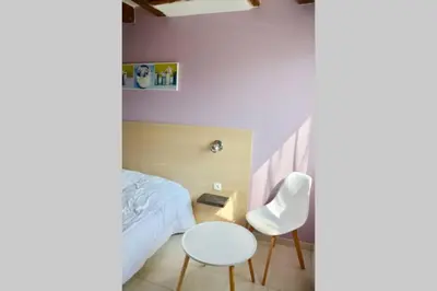 Un ou plusieurs lits dans un hébergement de l'établissement La petite maison 4
