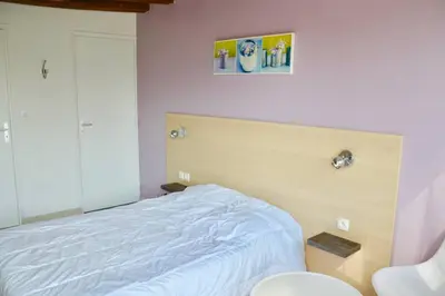 Un ou plusieurs lits dans un hébergement de l'établissement La petite maison 4