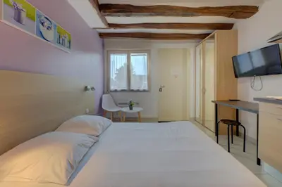 Un ou plusieurs lits dans un hébergement de l'établissement La petite maison 4