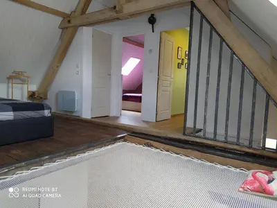 Un ou plusieurs lits dans un hébergement de l'établissement Gîte L'atelier
