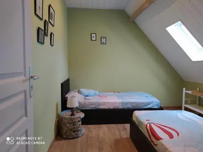 Un ou plusieurs lits dans un hébergement de l'établissement Gîte L'atelier