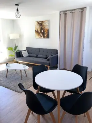 Coin salon dans l'établissement Une parenthèse de confort à proximité du centre
