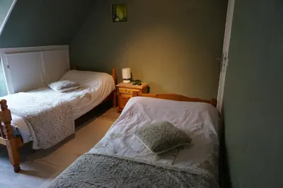 Un ou plusieurs lits dans un hébergement de l'établissement Le Petit Chaton