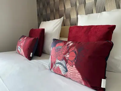 Un ou plusieurs lits dans un hébergement de l'établissement Logis hôtel Les Confins du perche