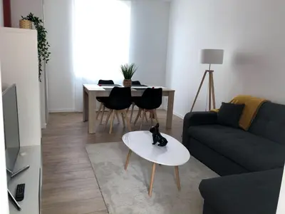 Coin salon dans l'établissement Grand appartement fonctionnel proche centre-ville