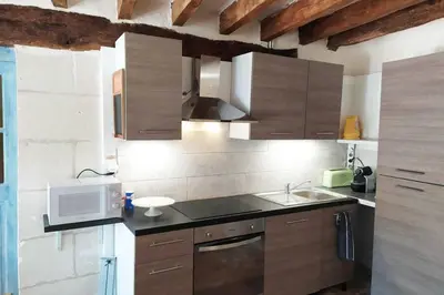 Cuisine ou kitchenette dans l'établissement Le Refuge des Elfes