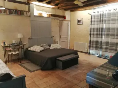 Un ou plusieurs lits dans un hébergement de l'établissement Le clos des augers, chambres d'hôtes et roulotte