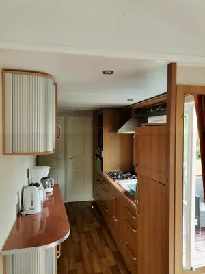 Cuisine ou kitchenette dans l'établissement Camping Au Clos de Beaulieu