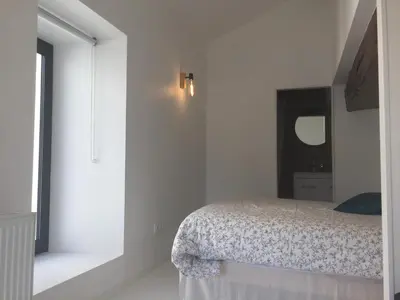 Un ou plusieurs lits dans un hébergement de l'établissement La Maison BellecOur