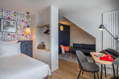 Un ou plusieurs lits dans un hébergement de l'établissement Ferdinand Hotel Tours