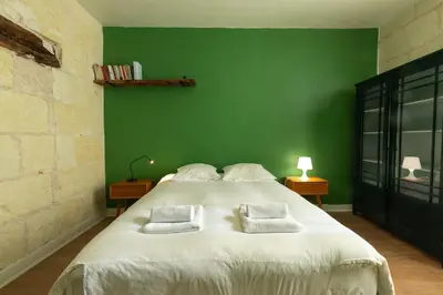 Un ou plusieurs lits dans un hébergement de l'établissement Chez Miriam - Maison de caractère - Ville avec jardin