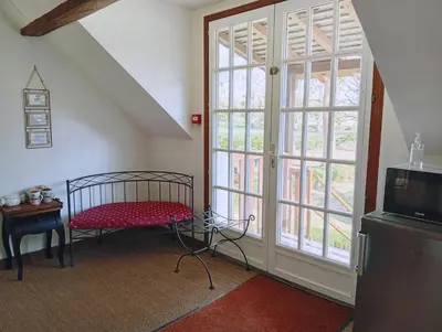 Télévision ou salle de divertissement dans l'établissement Chambres d'hôtes du domaine de l'Isle
