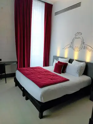 Un ou plusieurs lits dans un hébergement de l'établissement Best Western Premier Hotel de la Cite Royale