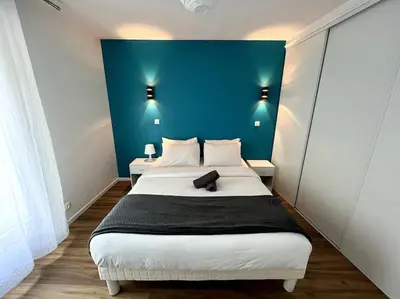 Un ou plusieurs lits dans un hébergement de l'établissement Moderne appartement - Gare - centre-ville