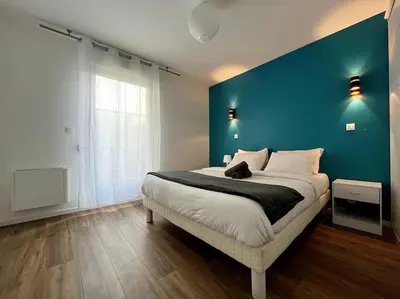 Un ou plusieurs lits dans un hébergement de l'établissement Moderne appartement - Gare - centre-ville