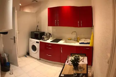 Cuisine ou kitchenette dans l'établissement Appart T1 Gare TGV spacieux et tout équipé