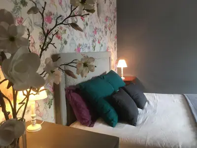 Un ou plusieurs lits dans un hébergement de l'établissement Auprès du château