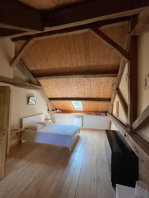 Un ou plusieurs lits dans un hébergement de l'établissement Le Moulin de cherré gîte bleu