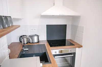 Cuisine ou kitchenette dans l'établissement Le Petit Cendrière
