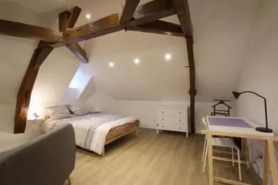 Un ou plusieurs lits dans un hébergement de l'établissement Studio neuf cosy La flèche
