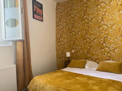 Un ou plusieurs lits dans un hébergement de l'établissement Hotel TULTY