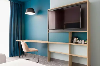 Télévision ou salle de divertissement dans l'établissement Hampton by Hilton Tours Centre, France